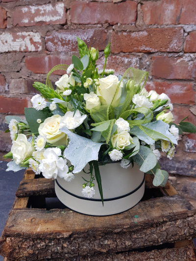 Olivia - A stunning arrangement of luxurious flowers in a white & cream colourway. Made to impress in a stylish hat box.