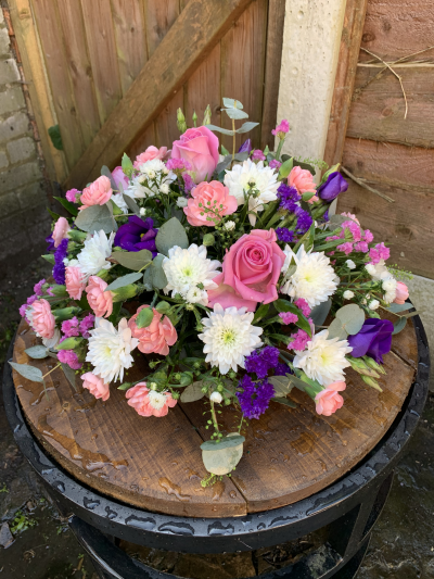 Posy SYM-345 - A classic funeral posy arranged with love using purple, lilac and white flowers.