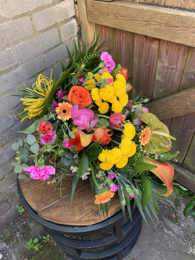 Sympathy Flowers SYM-334 - A selection of yellow, cream and white flowers with contrasting foliage in cellophane.