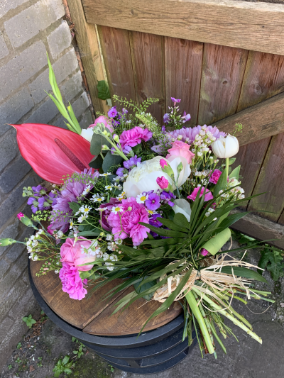 Eco Spray SYM-352 - Part of our Eco Range of floral designs, this single ended spray is made using a biodegradable base. Enter your choice of colours and we’ll make to order using the best available flowers.