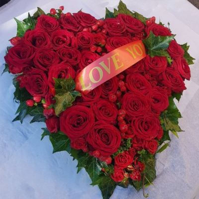 Eco Heart SYM-353 - This classic heart featuring a massed base and floral spray is the perfect loving tribute and is made using a biodegradable base. Let us know your favourite colour combination and we’ll make to order using the best available flowers.