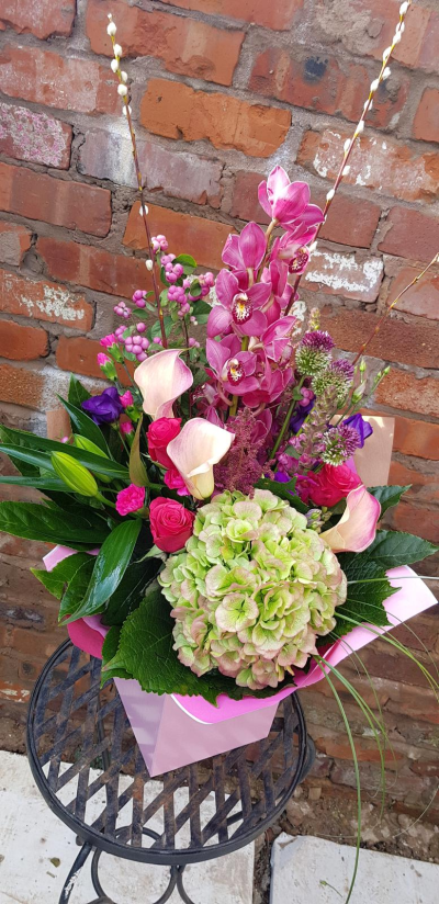 Summer Swing - Beautiful arrangement to include orchuds, willows, hydrangeas, calla lillies and roses