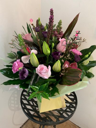 Happy times - Lovely round handtie in a box to include Lilies roses and callas