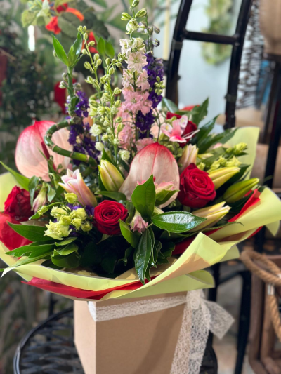 Oh Miss dreamer - Beautiful handtie box of  delphinium roses calla and lilies and anthuriums.
Content may vary depending on availability and season.