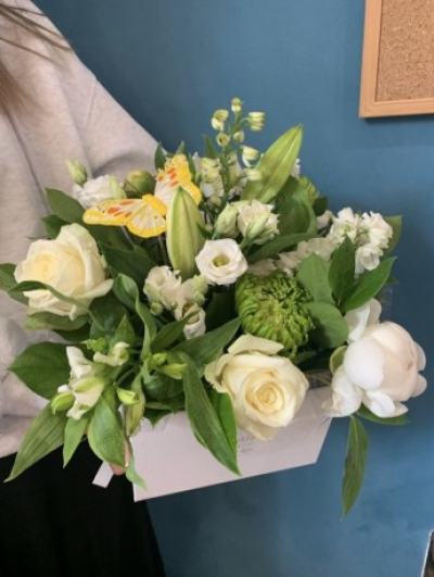 The White Delight Hatbox - The White Delight Hatbox using mixed seasonal flowers to include roses.