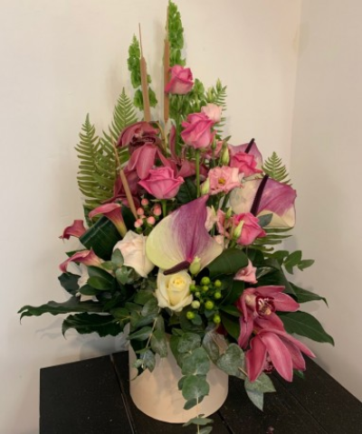 Beautiful Front facing arrangement - Beautiful Front facing arrangement to include Anthurium, callas, orchids and roses mixed.